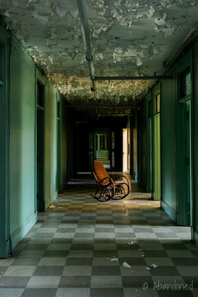 Medfield State Hospital Male Employees' Home Hallway with Lonely Wicker Chair